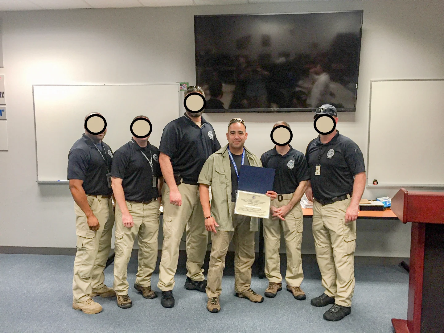 Credential presentation with a federal training cadre. Peers masked by request; work stays quiet.